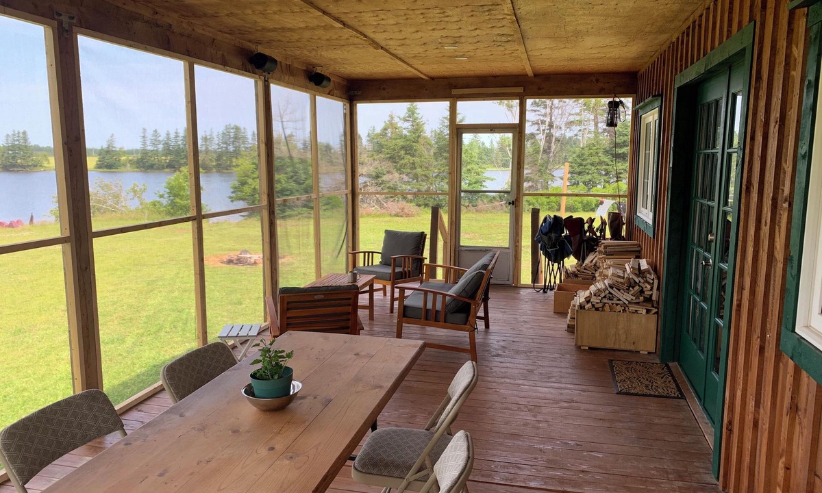 Prince County Cottage | Semi-private beach, huge screened in deck, woods on fenced in property.