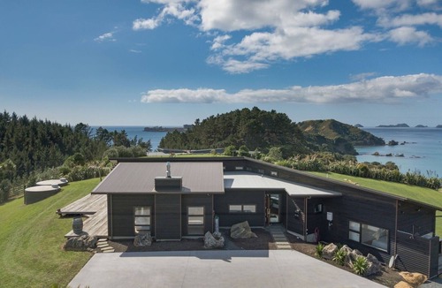 Mahinepua House | Coastal Gem. Great sea views, decks for outdoor living and safe swimming beach.