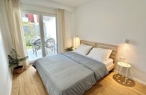 Olymbiaki Akti Apartment | Modern Seaside Home with Private Patio + Parking - Blue Zone Homes