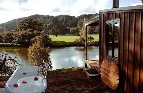 Kaeo Cabin | Off-Grid, Waterfront Glamping Cabin with Outdoor Shower and Bathtub, Perfect for a Romantic Escape to Kaeo, New Zealand