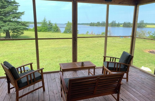 Prince County Cottage | Semi-private beach, huge screened in deck, woods on fenced in property.