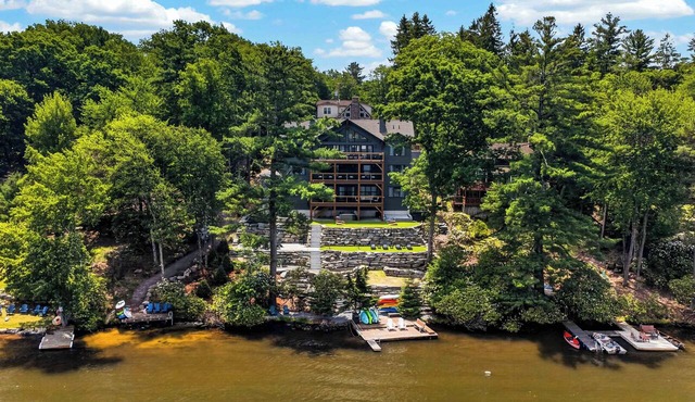 An Elevated Group Retreat with Soaring Glass, Lake Views, Boats, 3 Decks in Lake Harmony