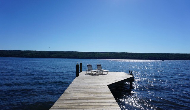 Charming lakefront cottage with private beach and boat dock.